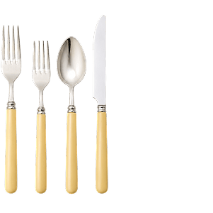A four-piece cutlery set with cream handles