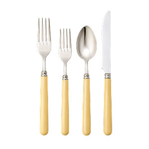 A four-piece cutlery set with cream handles